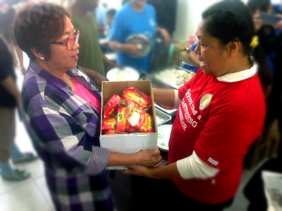 HELPING HANDS. NPC Ms. Rhodora Maestre handed to Municiapl Mayor, Hon. Liwayway DC Caramat packs of Healthy Pinoy Gourmix to be used in the massive blanket feeding of evacuees during the onslaught of Typhoon Lando in their municipality.